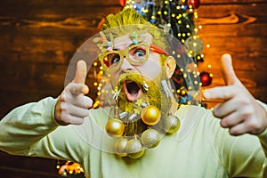 Funny Santa. Christmas preparation - man celebrating New Year. New year fashion clothes. Theme Christmas holidays and
