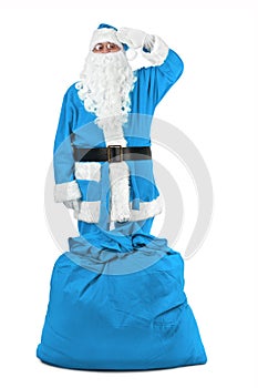 Funny santa claus in blue costume salutes photo