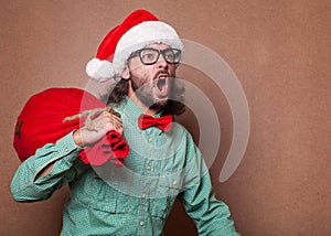 Funny Santa Claus with gift bag.