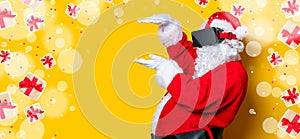 Funny Santa Claus have a joy with VR glasses