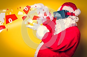 Funny Santa Claus have a joy with VR glasses