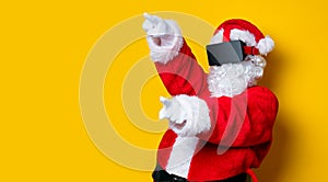 Funny Santa Claus have a joy with VR glasses