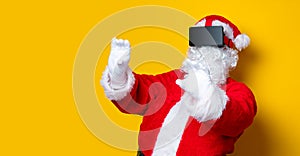 Funny Santa Claus have a joy with VR glasses