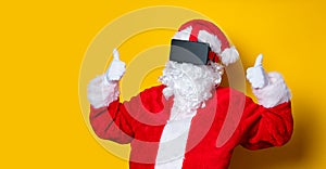 Funny Santa Claus have a joy with VR glasses