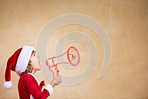 Funny Santa kid with drawn megaphone