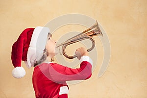 Funny Santa kid with horn