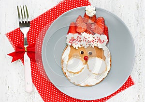 Funny santa pancake with mascarpone and strawberry