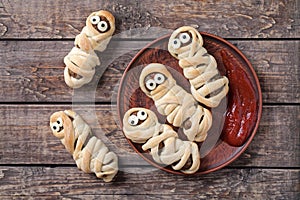 Funny sausage meatball mummies wrapped in dough