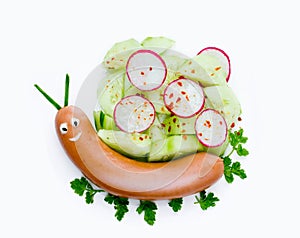 Funny sausage snail with vegetable salad isolated on white