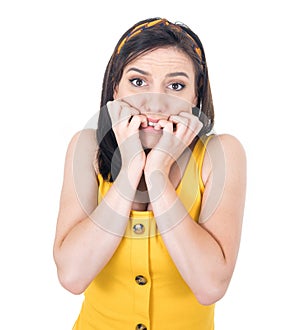 Funny scared young woman biting fingernail, being terrible accident, isolated on white background. Frightened girl
