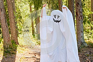 funny and scary ghost costume for halloween in the forest