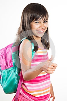 Funny school girl showing thumbs up