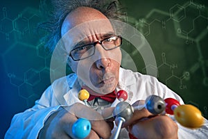 Funny scientist with molecules model