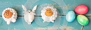 Funny selfmade animal shaped figures and colorful easter eggs on