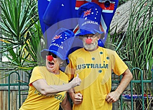 Funny senior couple having fun crazy costumes celebrating Australia Day