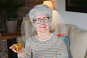 Funny senior woman about to play pranks