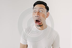 Funny shocked and surprised face of man isolated on white background.