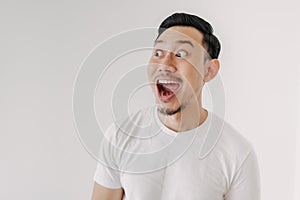 Funny shocked and surprised face of man isolated on white background.