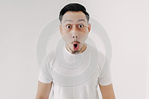 Funny shocked and surprised face of man isolated on white background.