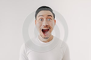 Funny shocked and surprised face of man isolated on white background.