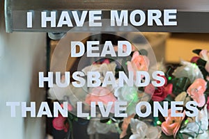 Funny sign, dead husbands