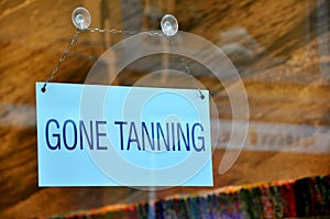 Funny sign: gone tanning
