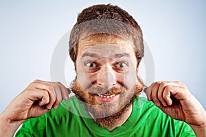 Funny silly man grabbing his hairy beard