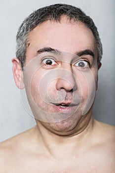 Funny silly stupid cheerful surprised middle-aged man