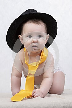 Funny six month old baby in elegant clothes