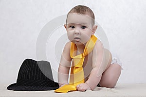 Funny six month old baby in elegant clothes