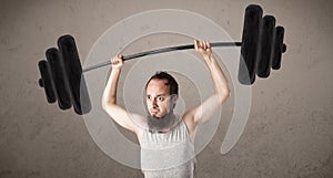 Funny skinny guy lifting weights