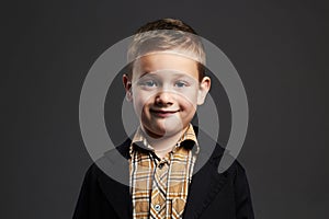 Funny smiling little boy.stylish child in suit