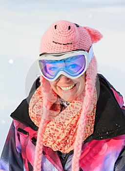 Funny snowboard girl with pig hat