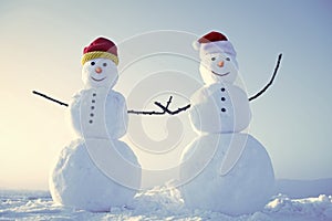 Funny snowmen. Snowman couple outdoor.