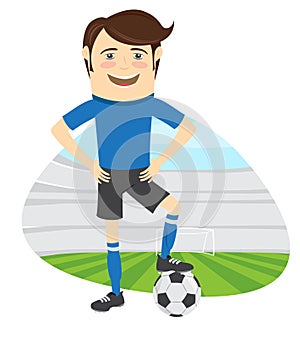 Funny soccer football player wearing blue t-shirt standing holding ball and smiling