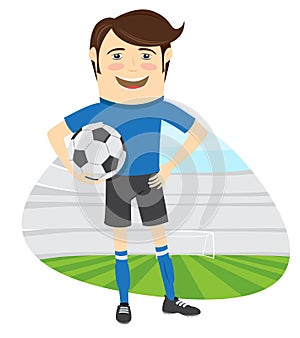 Funny soccer football player wearing blue t-shirt standing holding ball and smiling