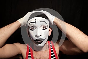 Funny stupid mime grabbed his head