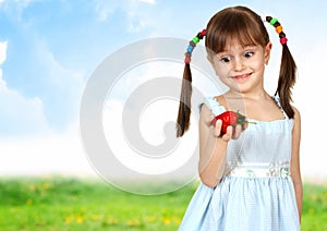 Funny surprised child girl with strawberry