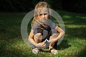 Funny Surprised Little Blonde Girl Screaming in the Park. Outdoors Portrait of Happy Acive Female Child