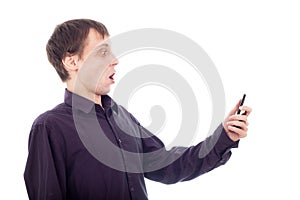 Funny surprised nerd man looking at cellphone