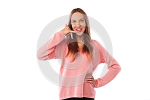 Funny teenager imitating a phone call conversation while posing photo