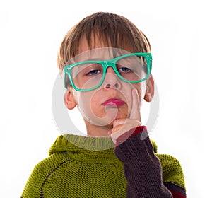 Funny thinking boy with glasses