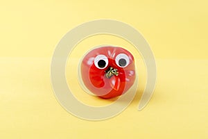 Funny tomato with googly eyes