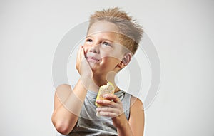 Funny toothless boy with sensitive teeth holding ice cream