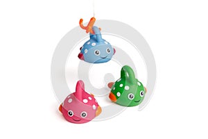 Funny toy children's colorful fish, one caught a hook