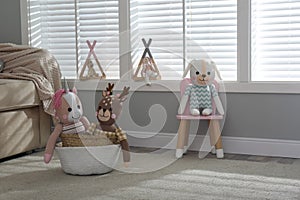 Funny toy unicorn, dog and deer in children`s room.  Interior design