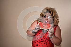 Funny travesty actor. Drag queen and watermelon. Feelings and emotions. Fat man and make-up