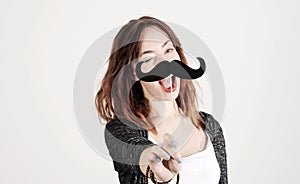 Funny trendy fashion girl with paper mustache playing with emotion