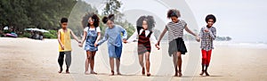 Funny vacation. Children or kids playing and romp together at the beach on holiday. Having fun after unlocking down the city from