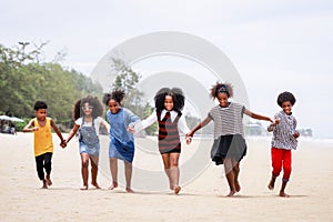 Funny vacation. Children or kids playing and romp together at the beach on holiday. Having fun after unlocking down the city from